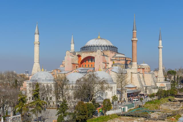 Hagia Sophia with its dome and four minarets under a clear blue sky
